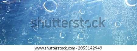 air bubbles underwater blue background, ocean depth diving