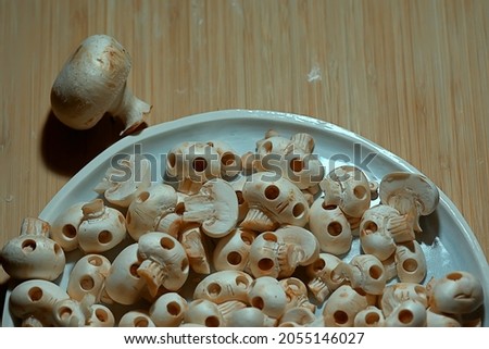 lot of skulls background, abstract texture mushrooms champignena natural decoration for the holiday food halloween day of the dead