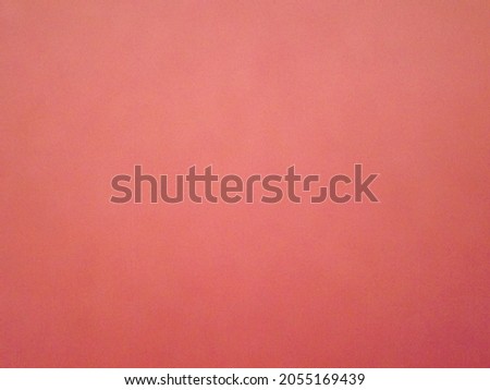 Burgundy, crimson, red, pink paper surface with a clear separation of colors as a background. High quality photo