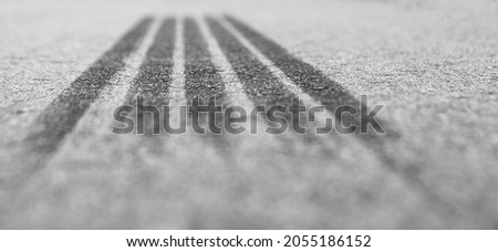 The brake track is a tire on the asphalt. Tire track. Shallow depth of field. Royalty-Free Stock Photo #2055186152