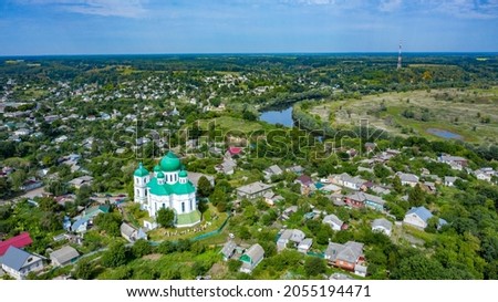 Bird's eye view of an old church in a village on a beautiful summer day. Picture from above an ancient church during day time
