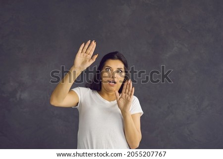 Scared millennial Hispanic woman on black studio background make stop hand gesture frightened terrified. Scary young Latino female feel afraid, shocked by unexpected unbelievable. Fear concept.