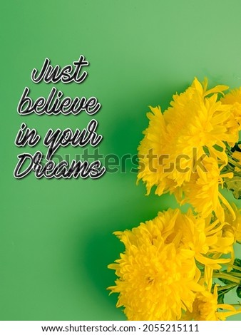 Motivational quoue of Just believe on yourself on a green background with yellow fresh flowers