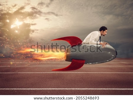 Businessman drives a fast rocket to win a challenge Royalty-Free Stock Photo #2055248693