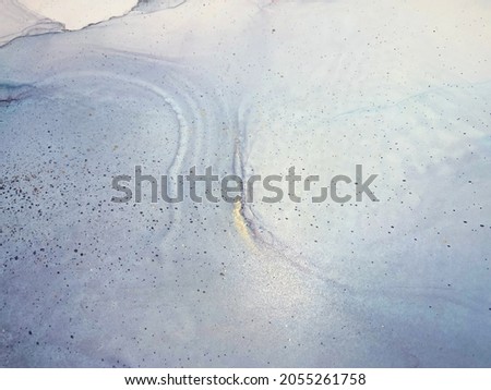 Abstract blue art with gray and gold — blue background with smudges, stains and spots made with alcohol ink and golden paint. Grey fluid texture resembles marble, smoke, watercolor or aquarelle.