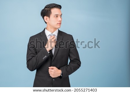 Handsome and friendly face asian businessman smile in formal looking away on white background studio shot. Royalty-Free Stock Photo #2055271403