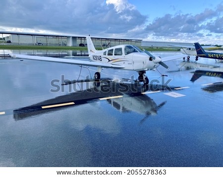 Venice Airport. Piper Warrior ll PA28-161. Beautiful piper warrior in very good shape, I captured this photo while on a thunderstorm to blow through before departure.   Royalty-Free Stock Photo #2055278363