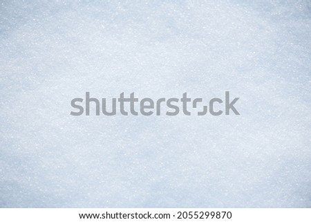 Snow background, winter backdrop. Christmas nature. White cold waves of snow sparkles in the sun. Xmas abstract background