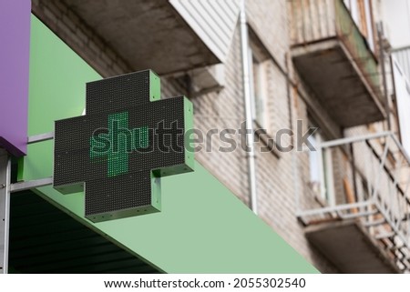 Close up of medical cross on pharmacy building, pharmacy and pharmacology concept