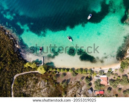 Overhead drone photos of the bay of Vourvourou with luxurious boats, in Northern Greecem Halkidiki 