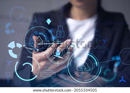 Businesswoman in formal wear holding in the hands a smart phone and testing an innovative application to provide a completely new service. Close up shot. Hologram tech graphs. Concept of Dev team.
