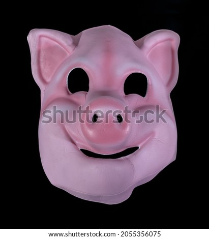 Child Pig Mask Isolated Against Black Background