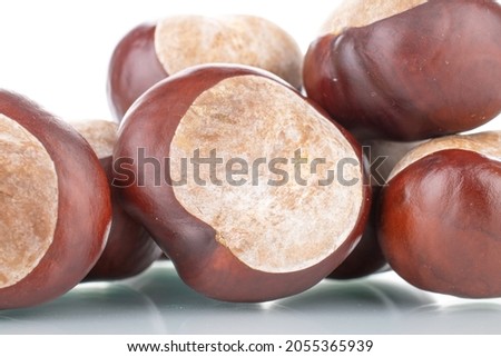 Several peeled chestnuts, close-up, isolated on white.