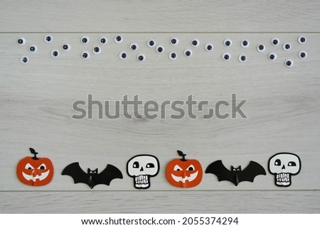 Halloween figures on wooden background