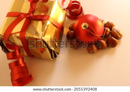 Merry Christmas decoration with wrapped golden gifts. Close up with a white background. 