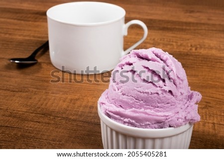 Grape flavored purple ice cream ball served in pot. Gourmet photography close-up ice cream parlor and ice cream parlor