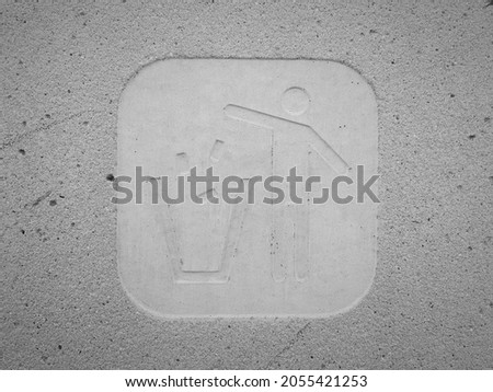 Trash can symbol in concrete wall. Garbage container icon. Industrial pattern. 