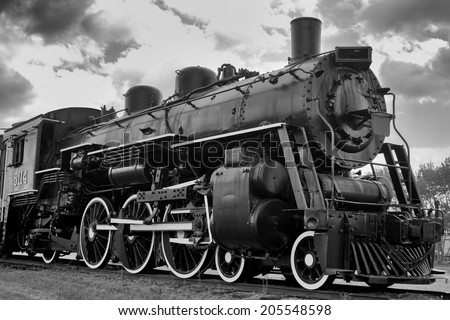 Old steam engine locomotive Royalty-Free Stock Photo #205548598