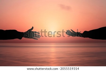 Human hand Asking help Concept Get Hired Concept. hands helping each other Against Sunrise sea background. People helping, God salvation and Peace concepts Royalty-Free Stock Photo #2055519314