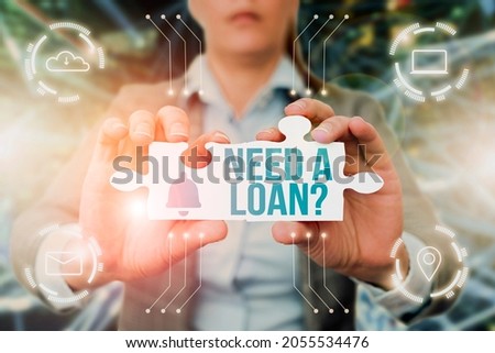 Conceptual caption Need A Loan Question. Conceptual photo asking he need money expected paid back with interest Business Woman Holding Jigsaw Puzzle Piece Unlocking New Futuristic Tech.