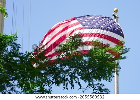 the American flag waving. photo during the day.