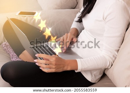 Review concept, five stars, Young woman with laptop. Rate your experience with star icons. High quality photo