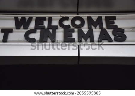 A cinema sign above a theater door