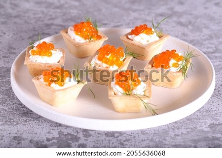 canapes with red caviar and cheese for the New Year's table