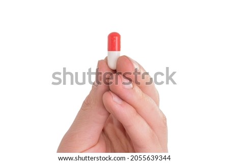 tablet capsule is held in the hand with your fingers