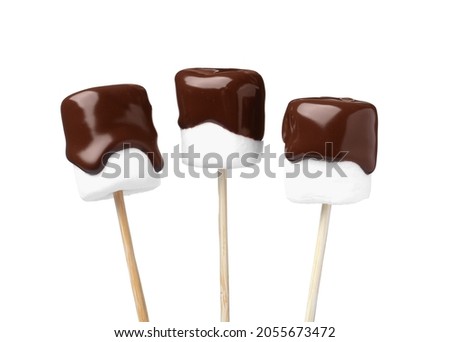 Tasty marshmallows dipped into chocolate on white background Royalty-Free Stock Photo #2055673472