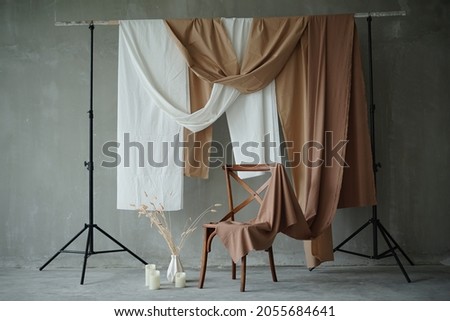 Wood Chair Studio Setup Photography with brown and white fabric Ornaments Decoration. 