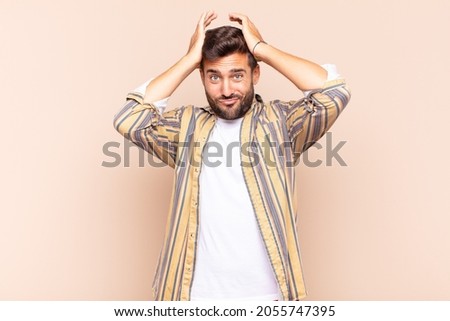 young man feeling frustrated and annoyed, sick and tired of failure, fed-up with dull, boring tasks