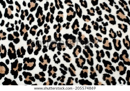 Brown and black leopard pattern. Fur animal print as background.