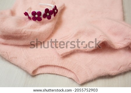 Knitted women's sweater on a white background