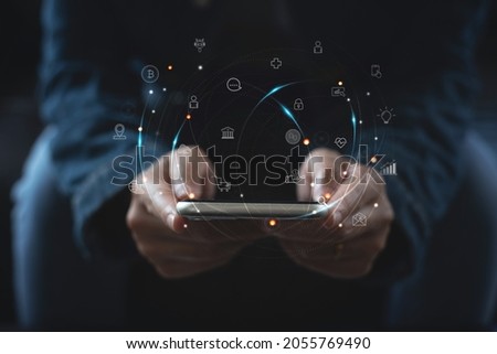 IoT, Internet of Things, online shopping, digital marketing, E-commerce, business and technology concept. Woman using mobile phone for online shopping and banking via mobile app, Pay Per Click (PPC) Royalty-Free Stock Photo #2055769490
