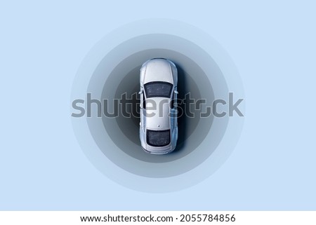 Automobile with gps tracking pulsing signal. A vehicle transmitting gps signal. Searching car location with gps tracker. Royalty-Free Stock Photo #2055784856