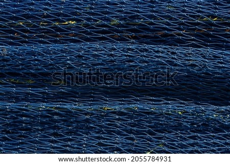 Close-up of fishing nets. Background image of fishing and overfishing of fish stocks