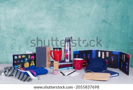 Composition of different promo products -Thermo mug, mug, gifts, flash drive, pens, notebooks,tie,Lanyards Neck Strap,Keychain. Royalty-Free Stock Photo #2055837698
