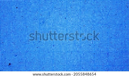 Aerial view of empty swimming pool blue mosaic background