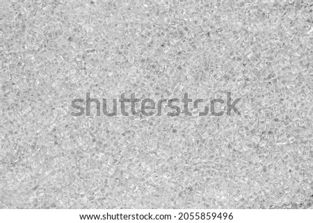 Transparent granules of polypropylene or polyamide. background. Plastics and polymers industry.  Royalty-Free Stock Photo #2055859496