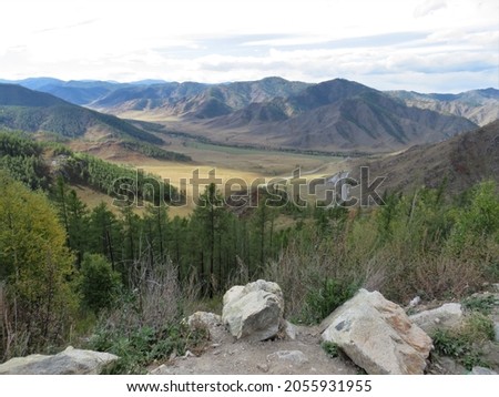 view of the mountain valley from a height on an autumn day