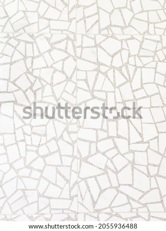 Mosaic, multi pieces of polygon ceramic on the cement floor.Like crack surface floor.