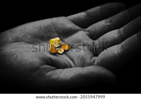 Yellow Diamonds on a Hand Royalty-Free Stock Photo #2055947999