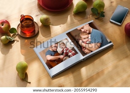 Outdoor family photo album lies on a  table