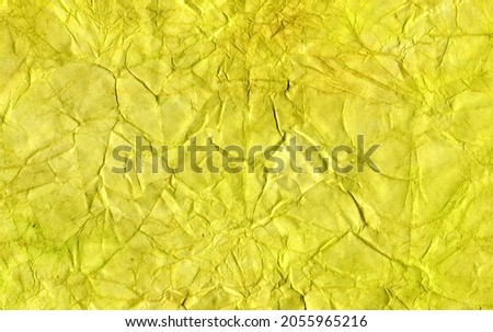 Abstract bright yellow-green background, banner with an empty place to insert, crumpled paper