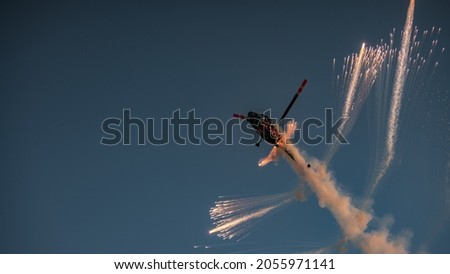 Helicopter airshow fireworks night photo