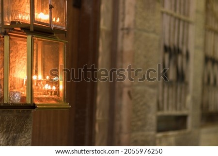 Hanukkah candles are lit at the entrance to old houses in the Jewish Quarter of Jerusalem