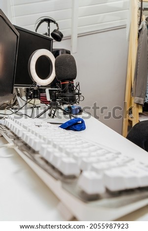 gamer workspace concept, high view a gaming gear, mouse, keyboard, headset, in ear headphone and mouse pad on white table background with copy space.