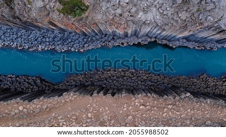 top down of studlagil canyon, extraordinary canyon with blue glacial river Royalty-Free Stock Photo #2055988502