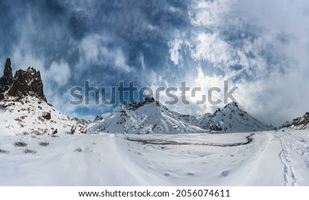 Beautiful panoramawinter scenery in the icelandic highlands with snow covered mountains and blue sky. Iceland, Highlands, expedition.